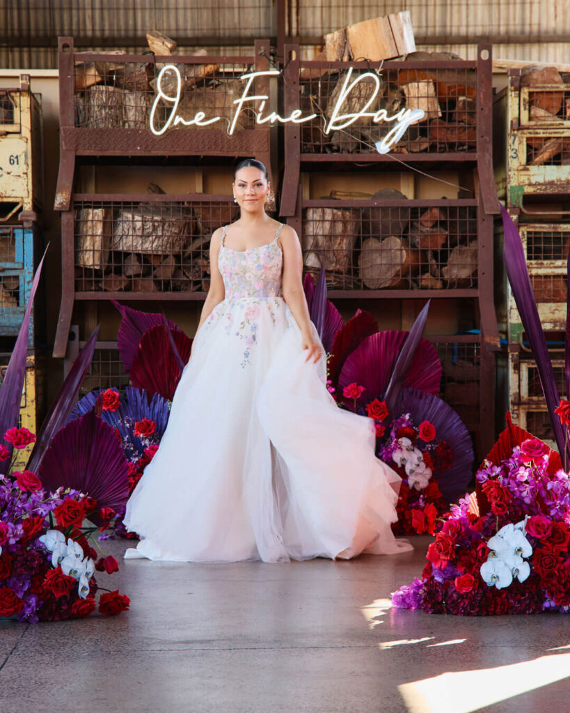 Bridal runway show in Melbourne featuring a model in a strappy ball gown floral bridal dress.