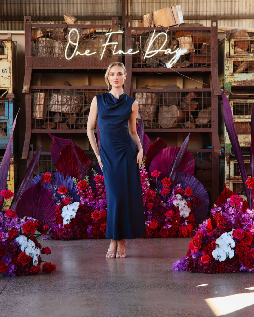 Elegant navy blue satin wedding dress highlighted on the catwalk during a bridal runway show in Melbourne.