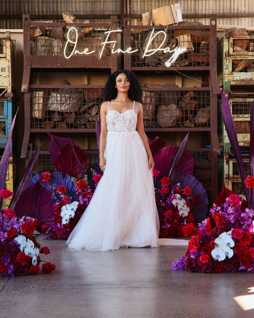 Romantic strappy lace wedding dress showcased on the catwalk during a bridal runway show in Melbourne.