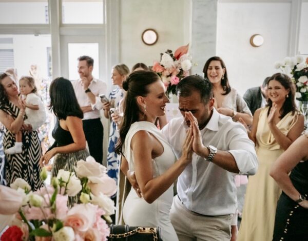 Venues Listing Category The Terminus Pyrmont Fun wedding party at Terminus Hotel Pyrmont, Wedding Venue in Sydney with newlyweds and guests dancing and laughing.