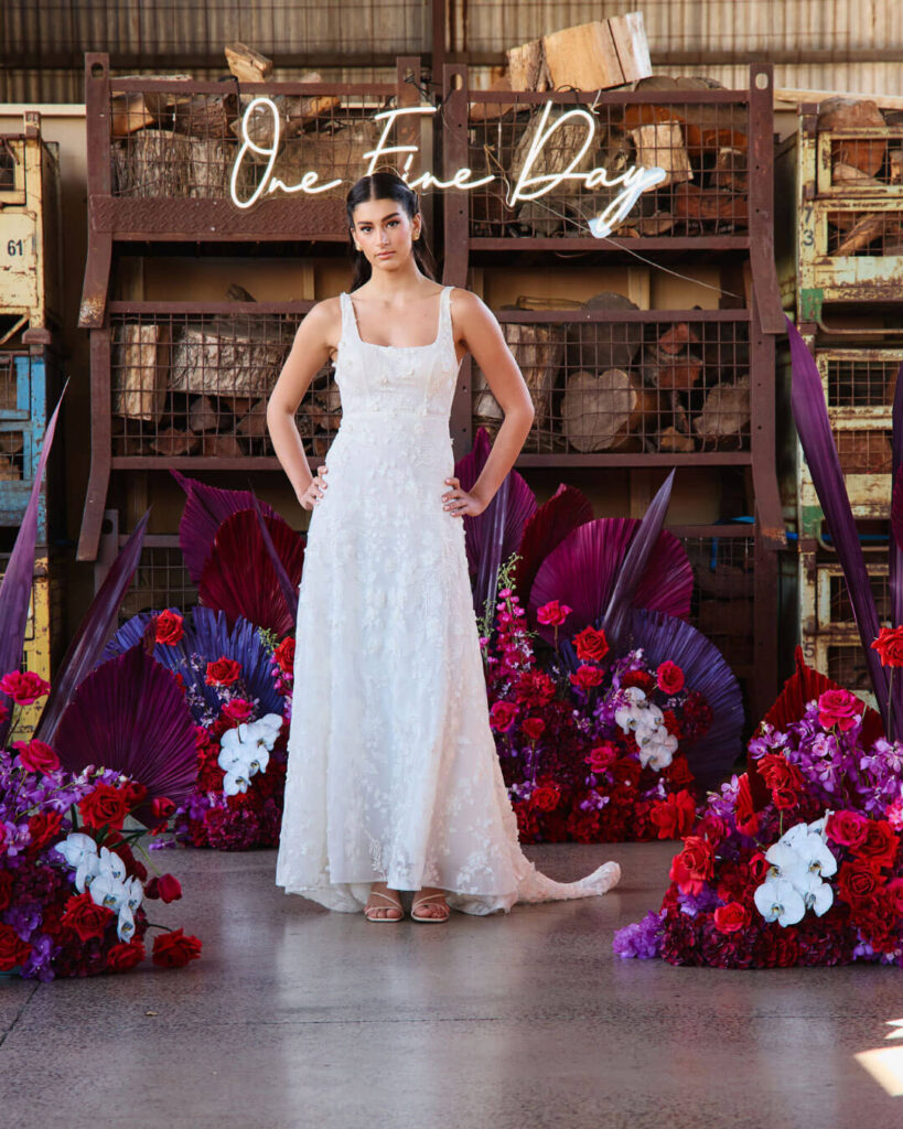 Romantic sleeveless lace wedding dress showcased during a bridal runway show in Melbourne.