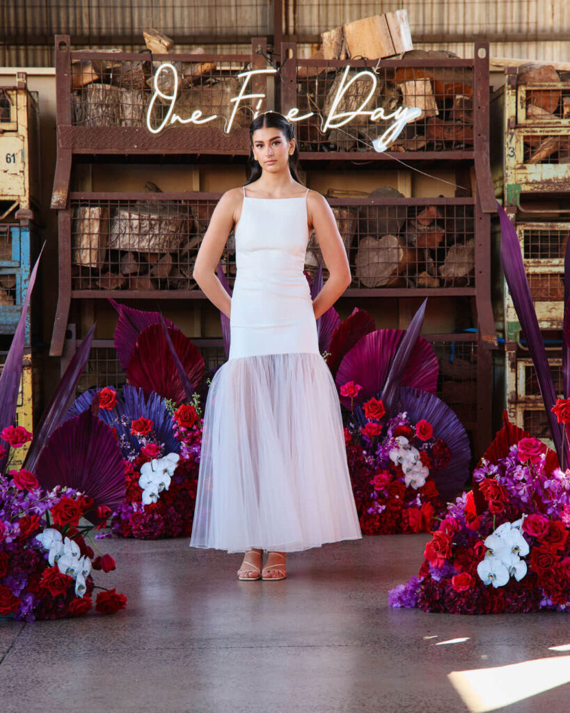 Bridal runway show in Melbourne featuring a modern strappy mermaid wedding gown with layered tulle design.