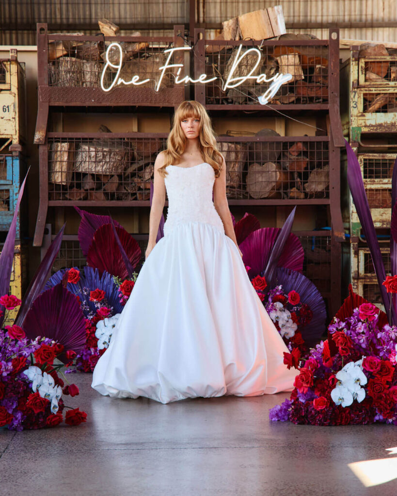 Bridal runway show in Melbourne featuring an elegant strapless ball gown bridal dress with voluminous skirt.