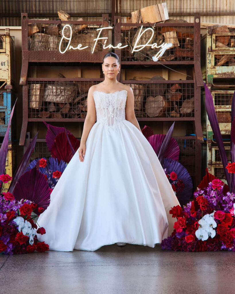 Classic strapless ball gown wedding dress with voluminous skirt showcased during a bridal runway show in Melbourne.