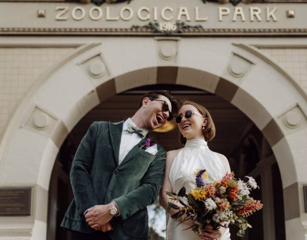 Photographers Listing Category Across the Forest Bride and groom standing at the front of taronga zoo wedding day