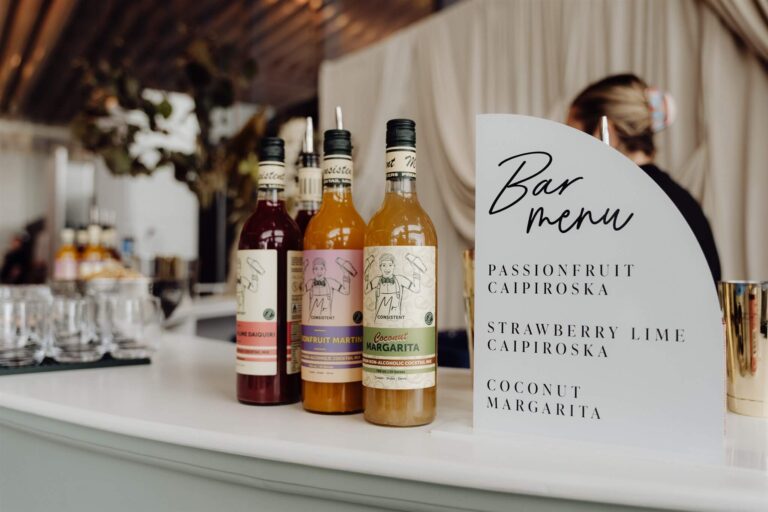 Display of three bottled drinks with bar menu at wedding expo in Sydney 2025