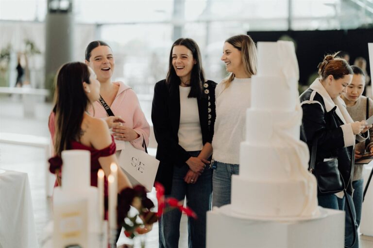 Visitors admiring wedding cake display at wedding expo in Sydney 2025