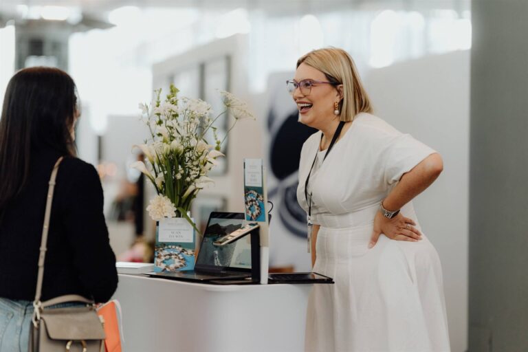 Side shot of exhibitors and visitors talking at wedding expo in Sydney 2025