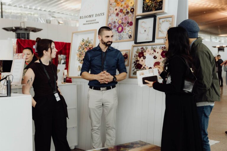 Visitors and exhibitors engaging in conversation at wedding expo in Sydney 2025