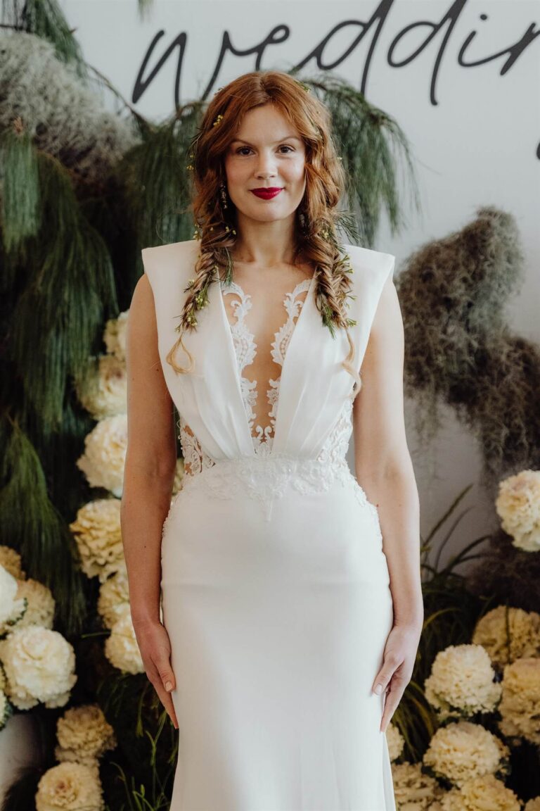 Close-up of model wearing deep V-line dress at wedding expo in Sydney 2025