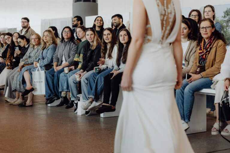 Model walking away showcasing gown back at wedding expo Sydney 2025