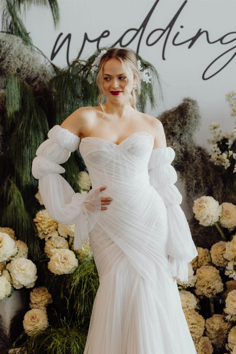 Close-up of tube-like long sleeve lace dress detail during wedding expo in Sydney 2025