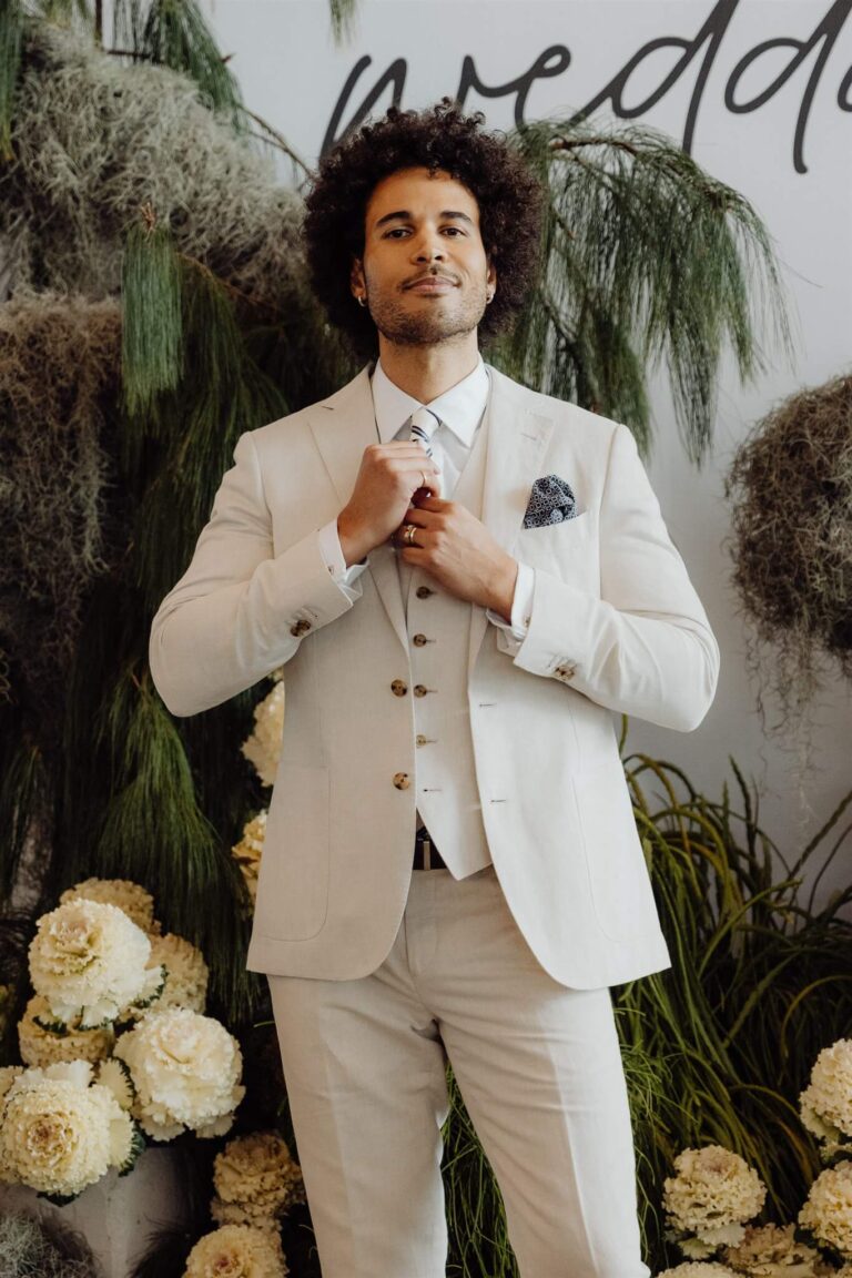 Close-up of male model in cream suit and pants during wedding expo in Sydney 2025
