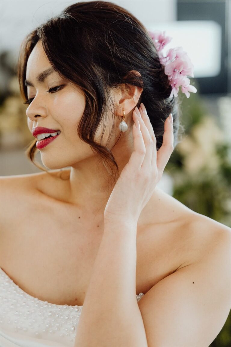 Model showcasing intricate earrings close-up during bridal runway show during wedding expo in Sydney 2025