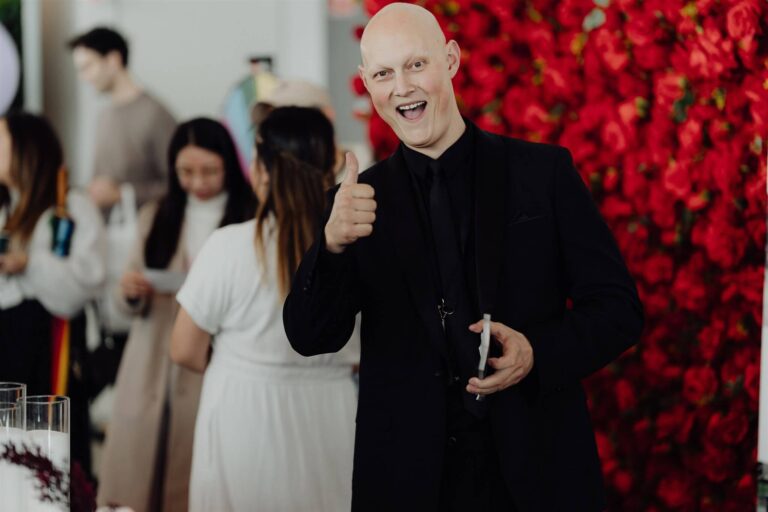 Wedding expo exhibitor giving thumbs up at wedding expo in Sydney 2025 event