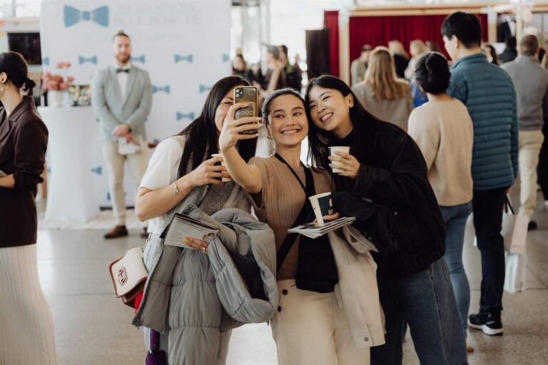 Three visitors taking selfie at wedding expo in Sydney 2025