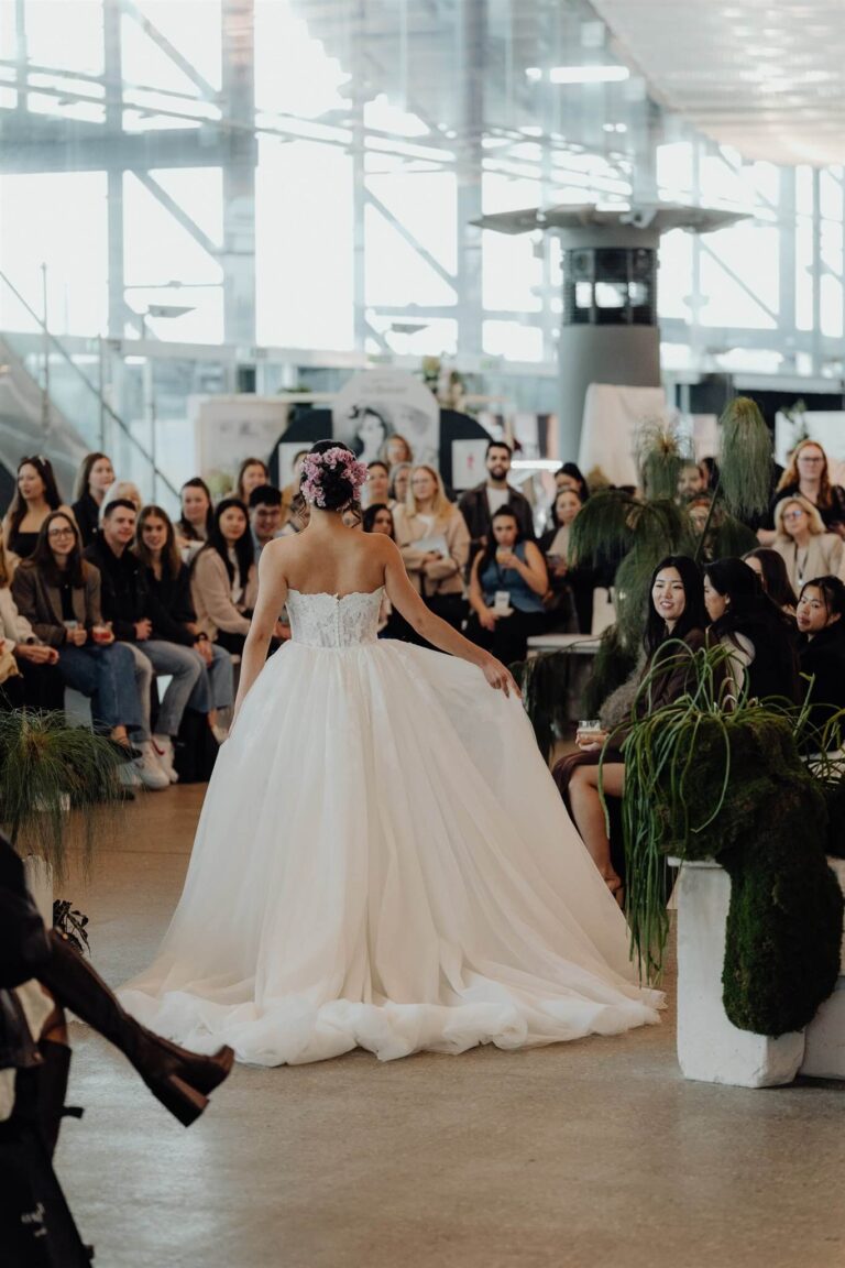 Bridal runway show model walking away from camera at the wedding expo in Sydney 2025 event