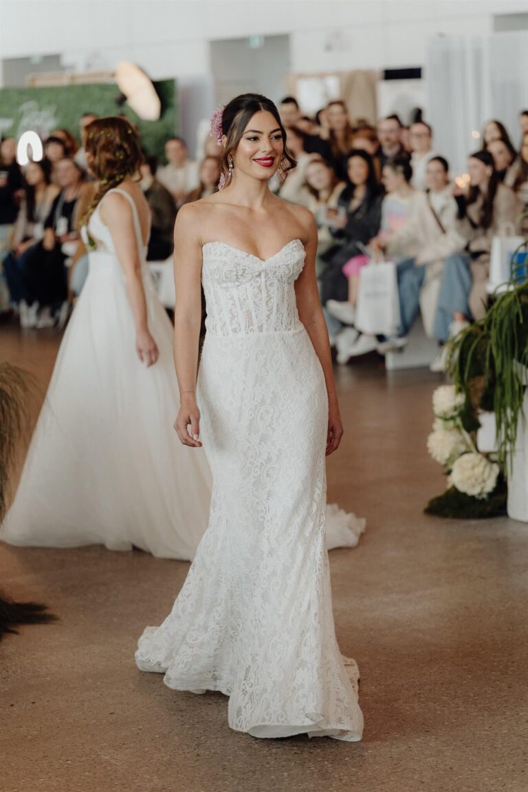 Models presenting designer bridal gowns on the runway at the wedding expo in Sydney 2025