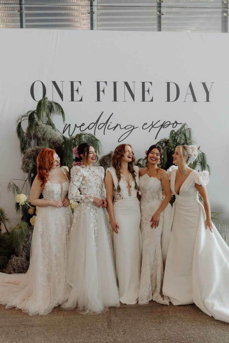 Full body shot of five models laughing together at wedding expo in Sydney 2025