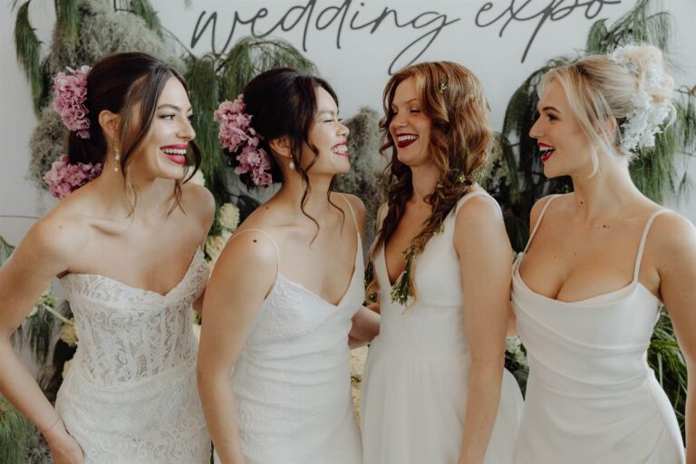 Bridal runway show models enjoying moment together laughing at wedding expo in Sydney 2025