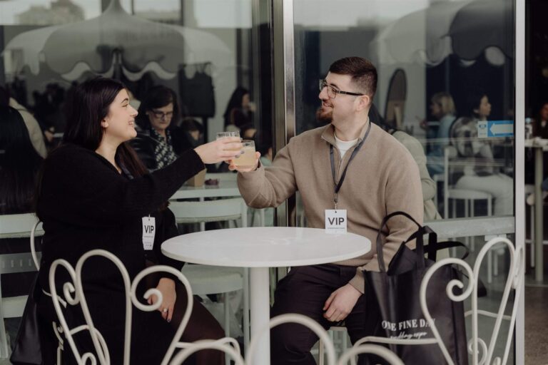 Exhibitors sharing a fist bump at wedding expo in Sydney 2025