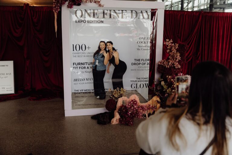 Two guests posing for photo at One Fine Day wedding expo frame booth at the wedding expo in Sydney 2025