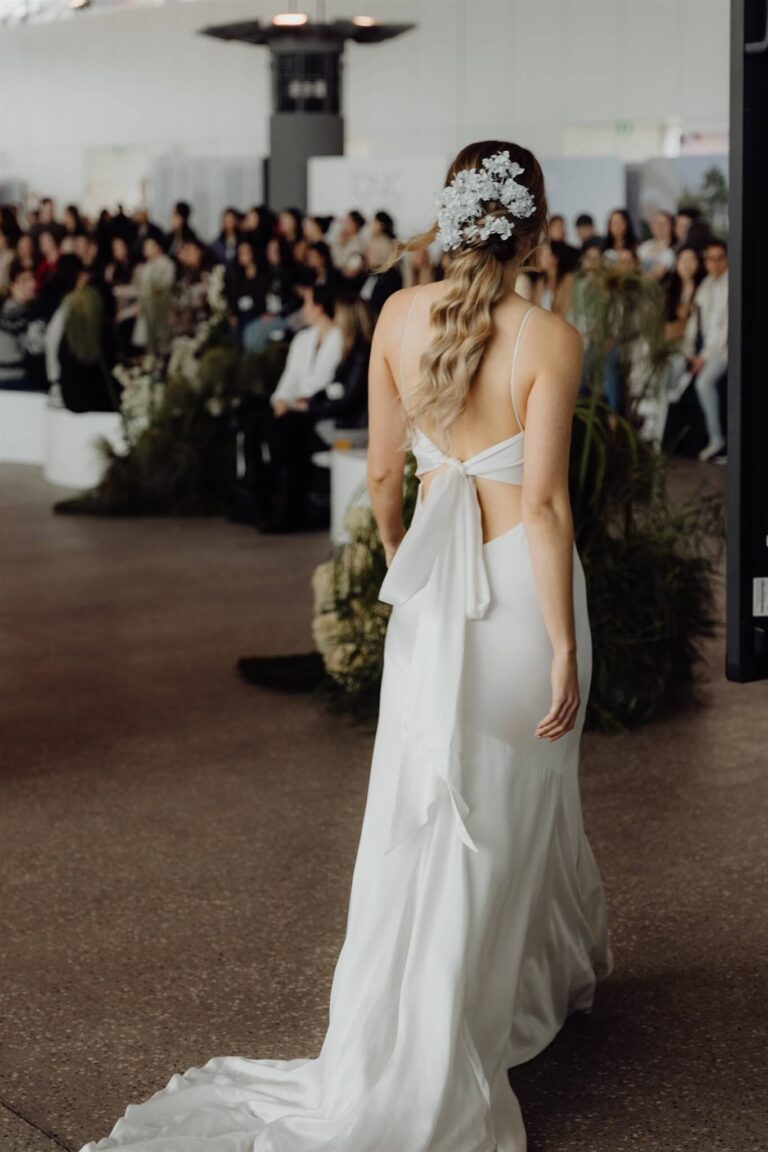 Rear view of bridal model on runway at wedding expo in Sydney 2025