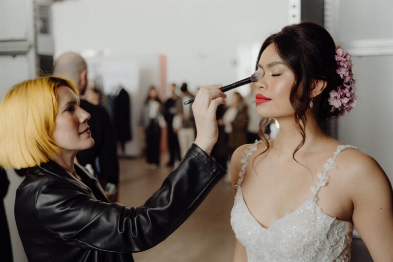 Close-up of model having makeup done by exhibitors at wedding expo in Sydney 2025