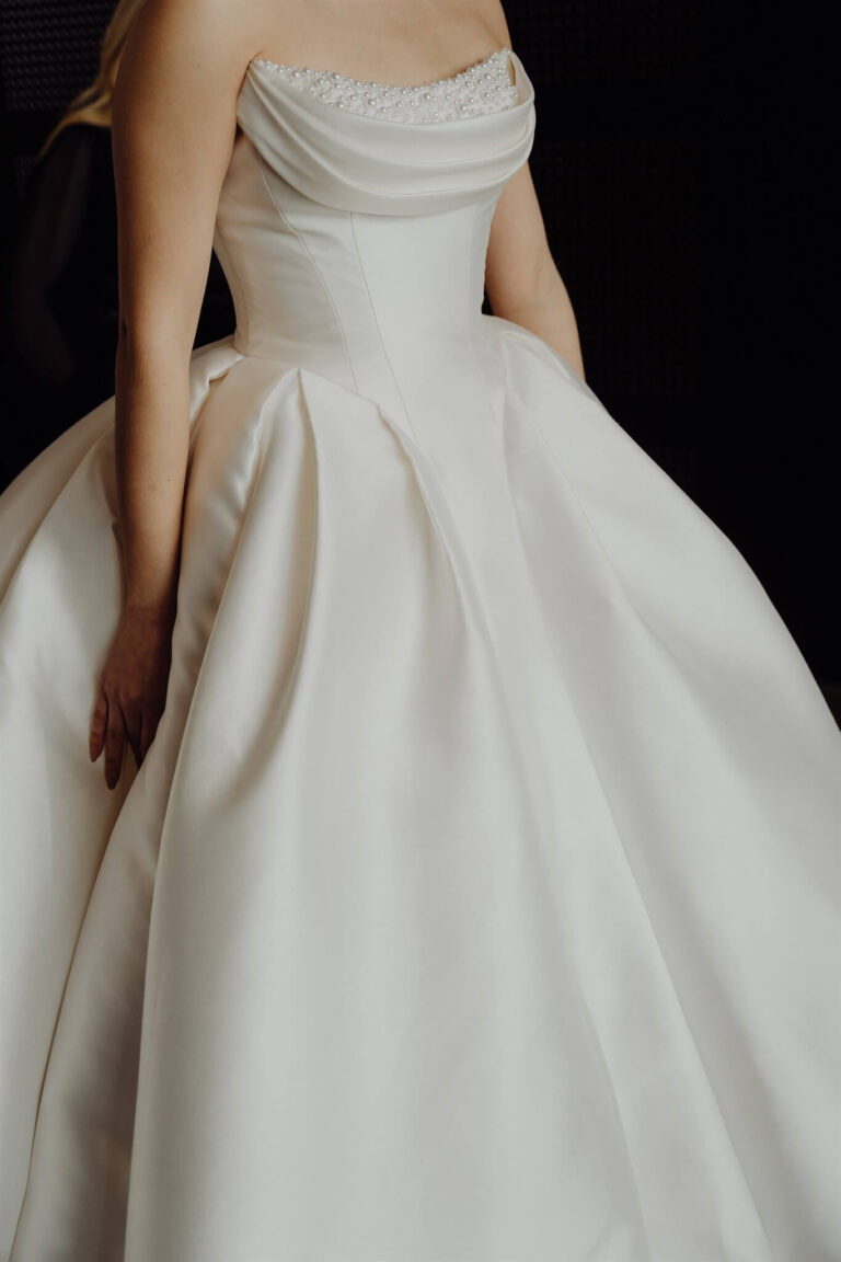 Elegant ball gown close-up showcasing design details at wedding expo in Sydney 2025
