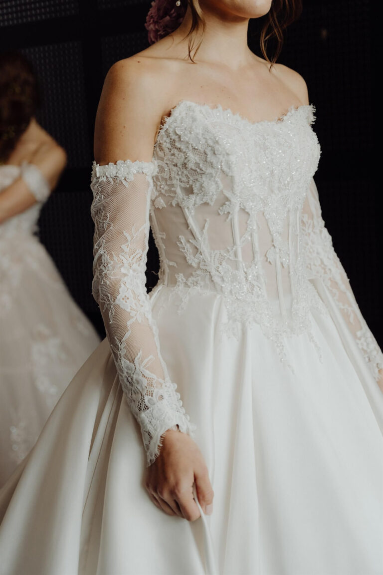 Detailed close-up of lace tube dress and gloves at the wedding expo in Sydney 2025