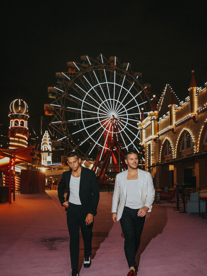 Luke Antony (The Voice) and DJ Kyle Maguire walking at vibrant night festival – trusted names in wedding entertainment Sydney