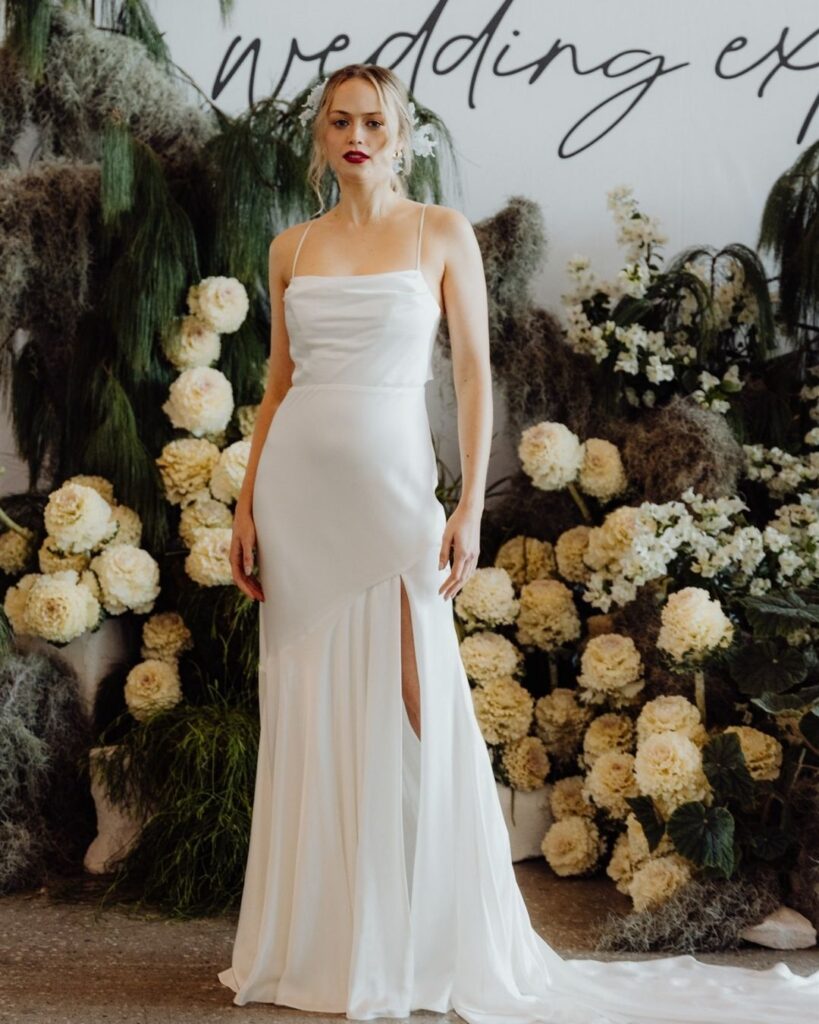 Model wearing satin wedding dress with thigh-high slit at the Bridal Runway Show in Sydney 2025