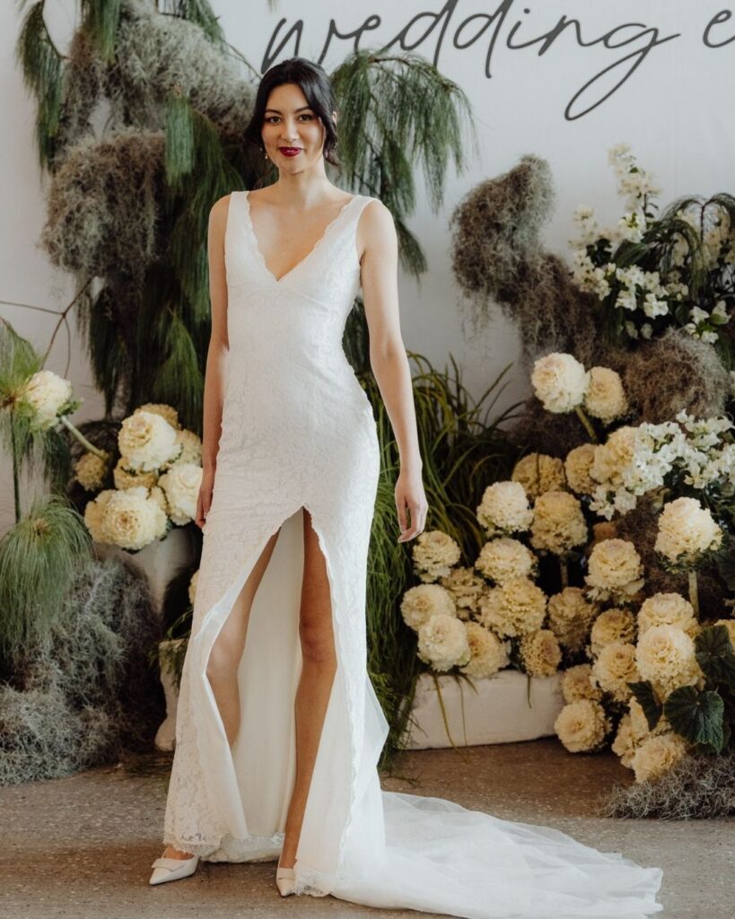Model wearing lace wedding dress with thigh-high slit at the Bridal Runway Show in Sydney 2025
