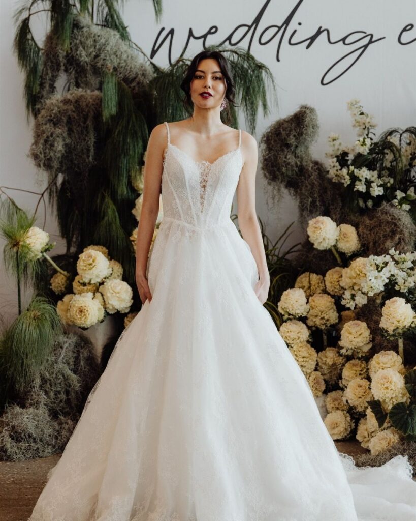 Close-up of spaghetti strap lace gown design during bridal runway show in Sydney 2025