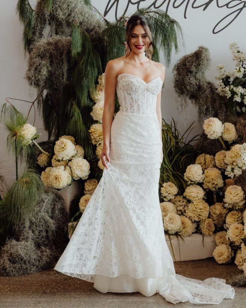 Elegant lace gown with tube-style bodice showcased at bridal runway show in Sydney 2025
