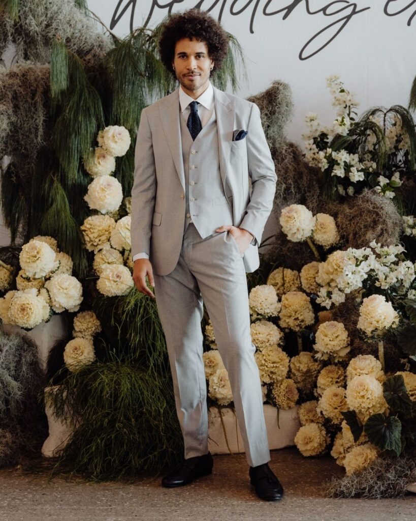 Model wearing grey suit with matching vest and pants at bridal runway show in Sydney 2025