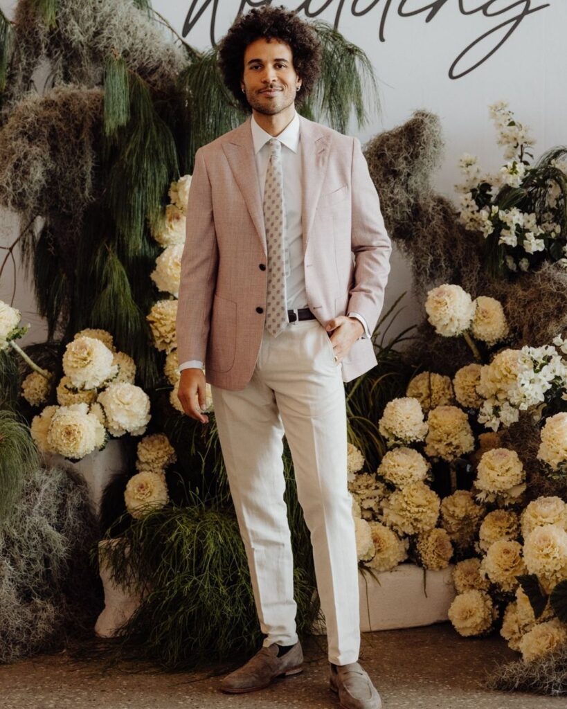 Model wearing light beige suit and cream pants at bridal runway show in Sydney 2025