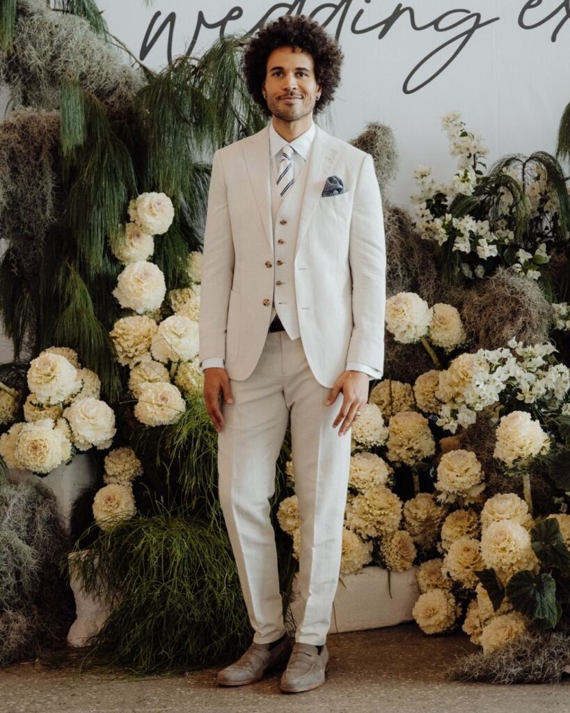 Close-up of male model in cream suit and pants during bridal runway show in Sydney 2025