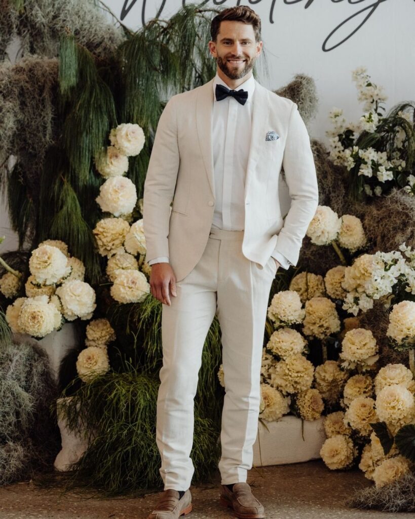 Model wearing white suit and pants at bridal runway show in Sydney 2025