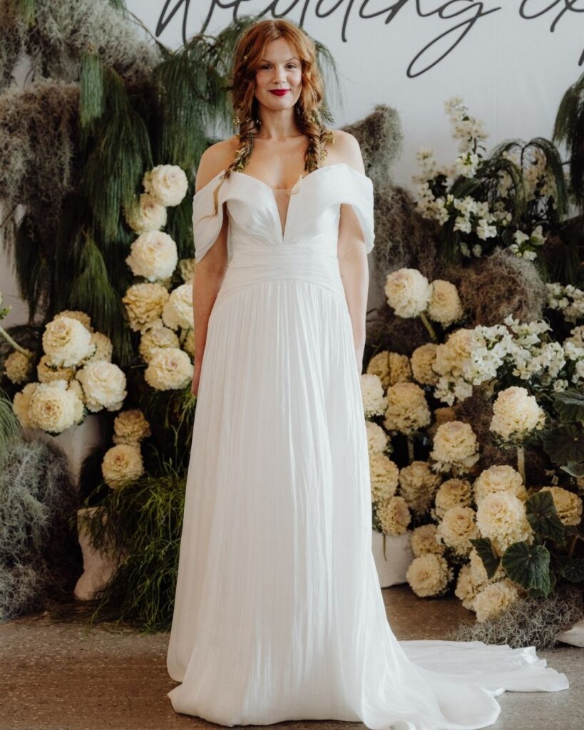 Bridal runway show in Sydney 2025 featuring a model in elegant off-shoulder floor-length gown