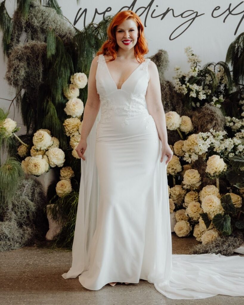Bridal runway show in Sydney 2025 featuring a model in elegant satin gown with deep V bodice