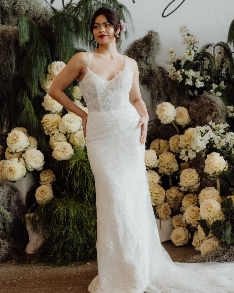 Model showcasing fitted bodice lace gown at bridal runway show in Sydney 2025