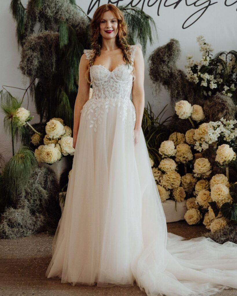 Elegant sleeveless lace top with chiffon skirt gown worn by model at bridal runway show in Sydney 2025
