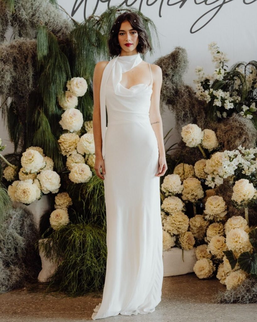 Model showcasing fitted long satin bodice gown at bridal runway show in Sydney 2025