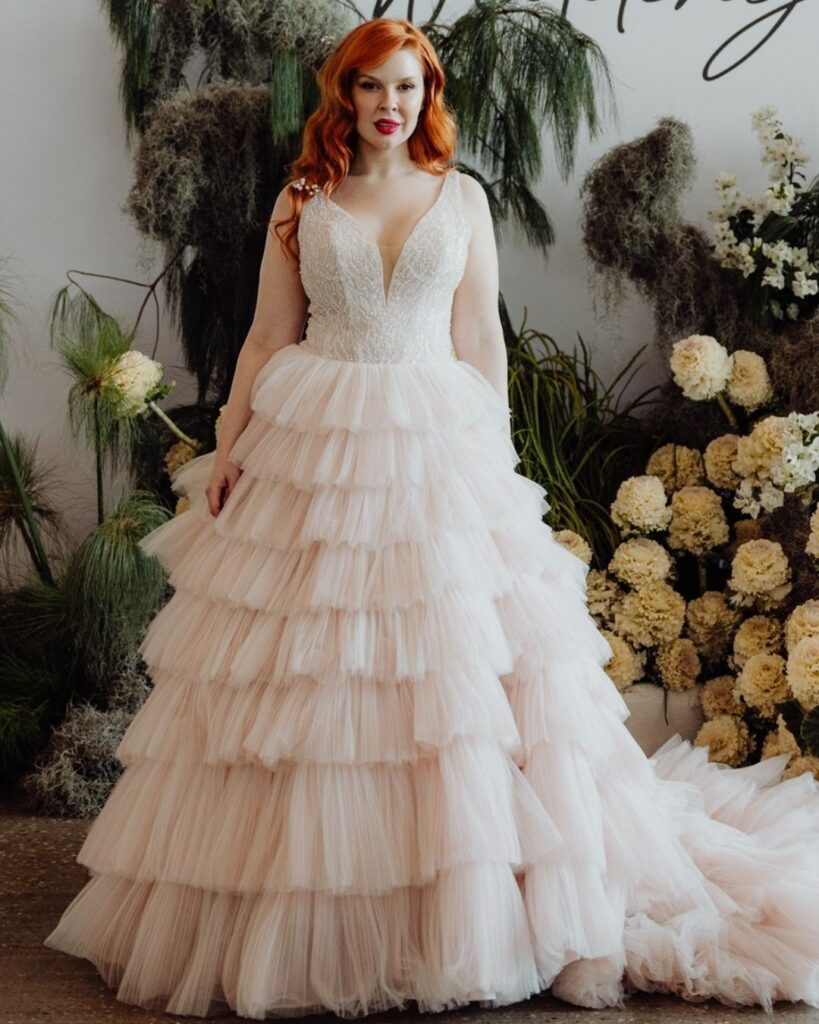 Close-up of deep V-line lace upper and layered chiffon bottom during bridal runway show in Sydney 2025