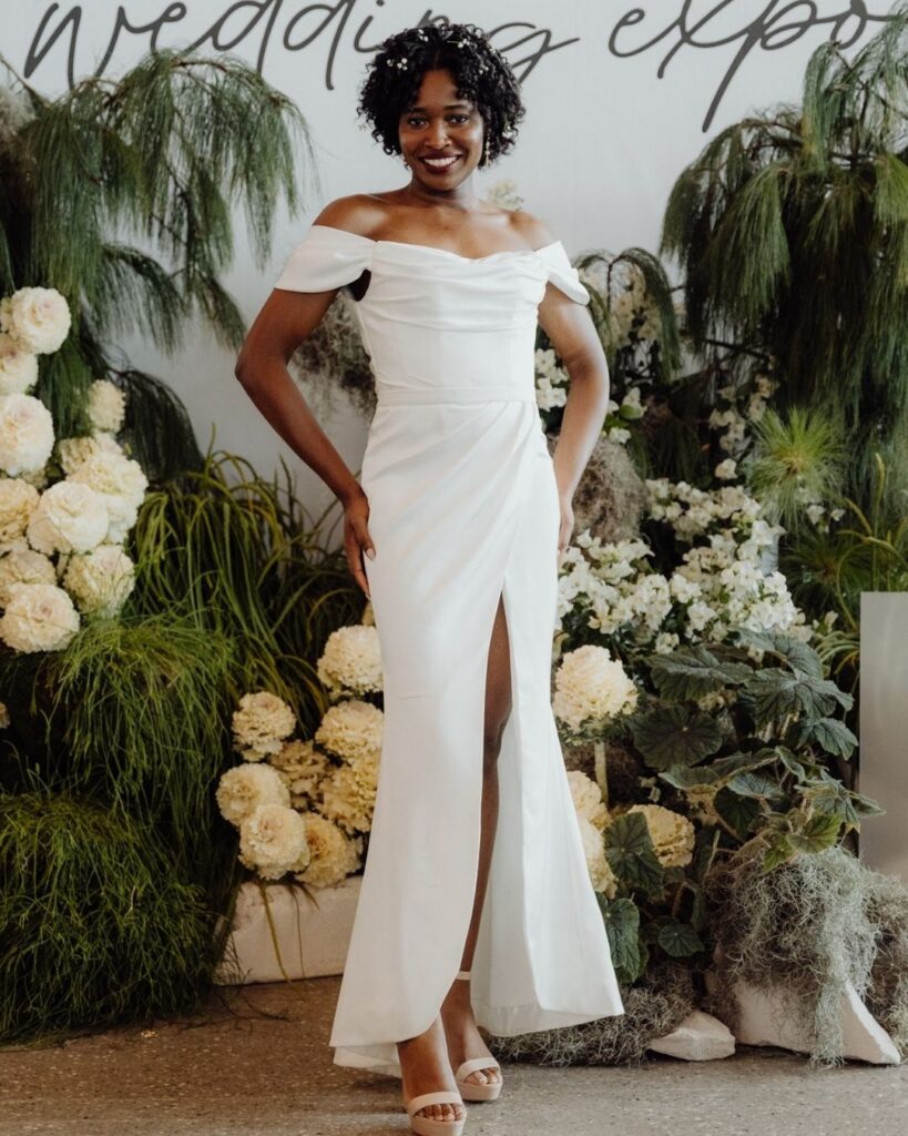 Model wearing off-shoulder bodice dress with high slit at bridal runway show in Sydney 2025