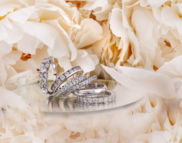 Accessories & Jewellery Listing Category KATE MCCOY FINE JEWELLERY Luxury custom made diamond and gemstone wedding rings styled on a floral background by Kate McCoy Jewellery Sydney.