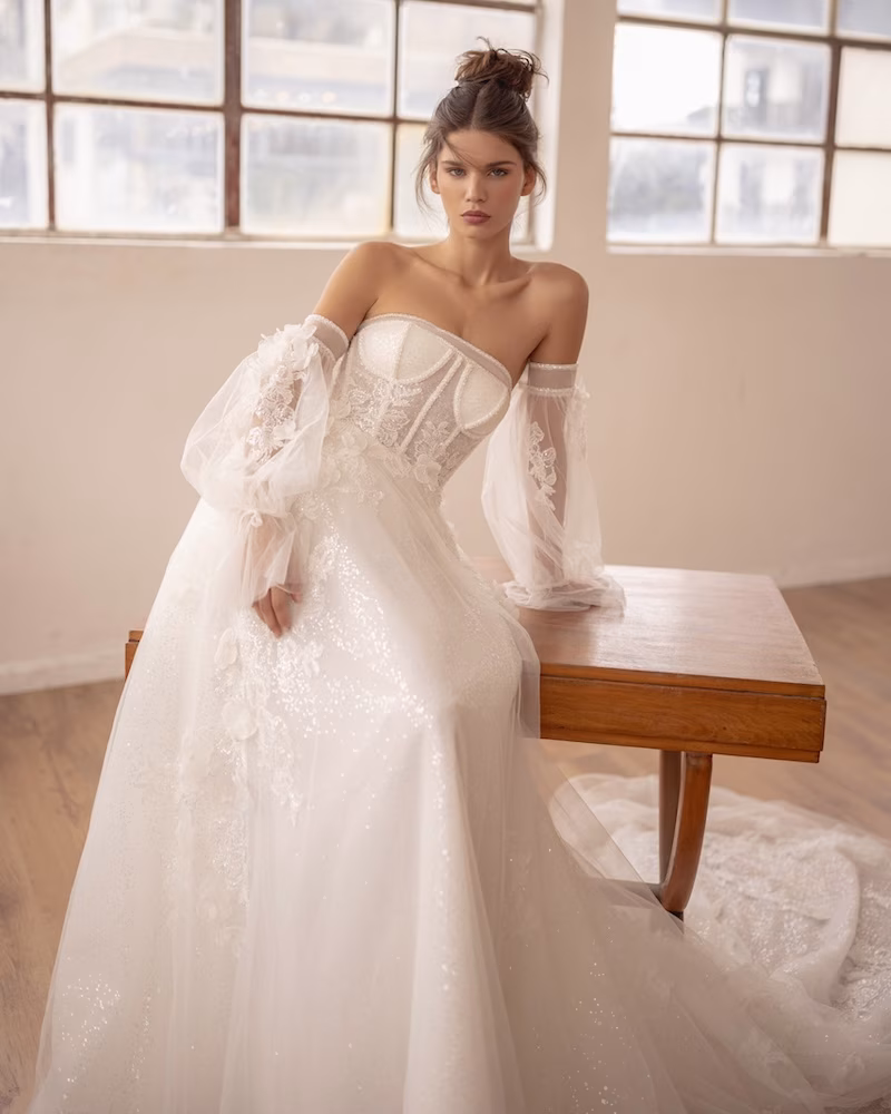 A bride with beautiful decorative sleeves on her wedding dress