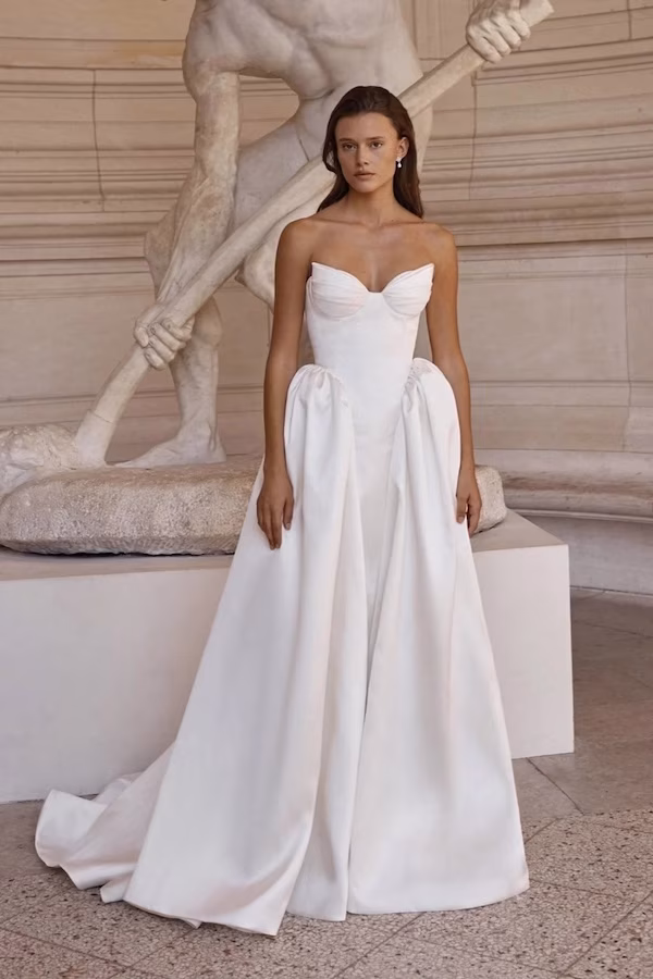A bride in a corset style wedding dress