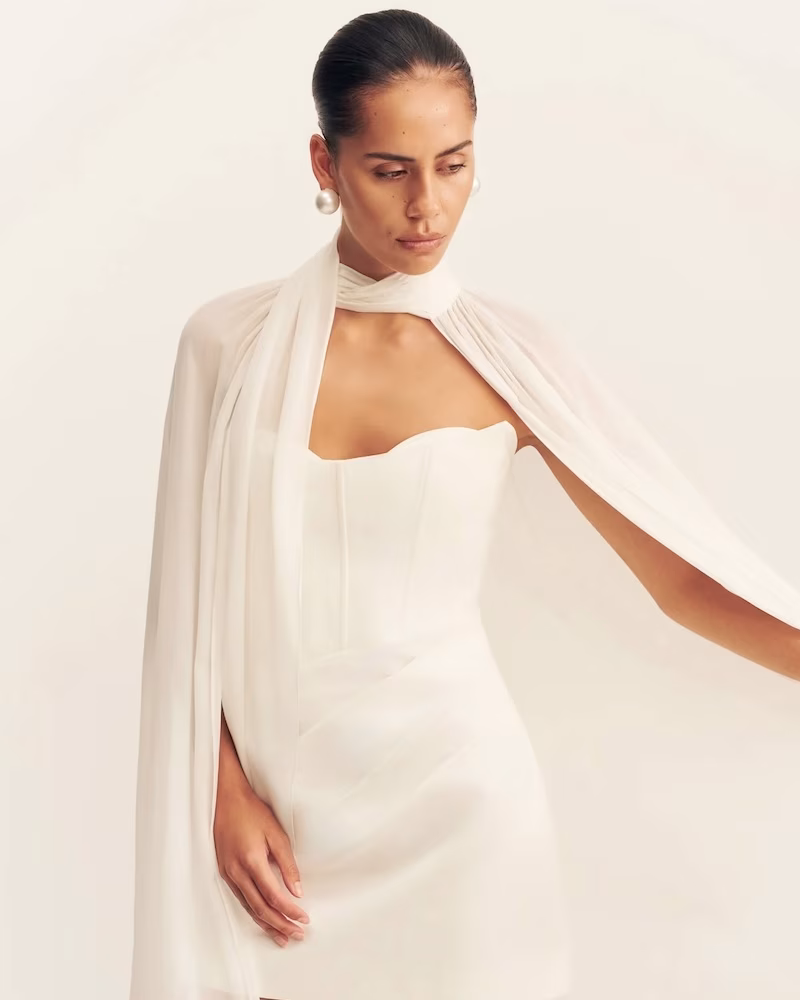 A sheer bridal cape by Shona Joy